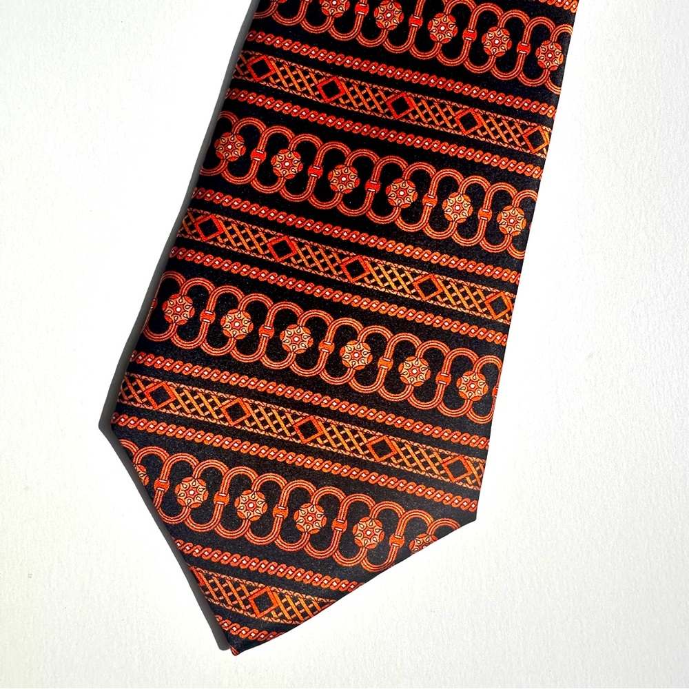 L’HOMME 100% imported Italian silk tie with abstract orange and black design
